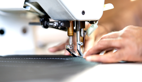Hands at sewing machine